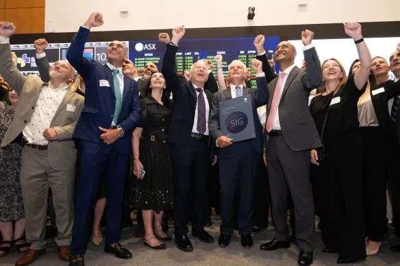 A crowd of franchisees, advisors, family and friends and employees cheered at the bell-ringing ceremony on Thursday.