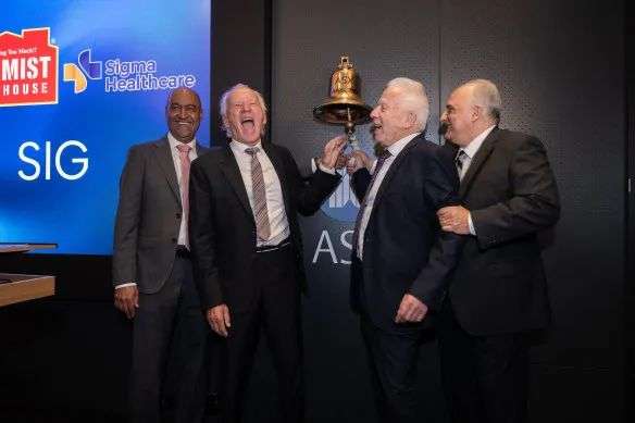 Cheers at the bell-ringing ceremony. Left to right: Sigma Healthcare CEO Vikesh Ramsunder; Chemist Warehouse co-founders Sam Gance and Jack Gance; Chemist Warehouse CEO Mario Verrocchi.