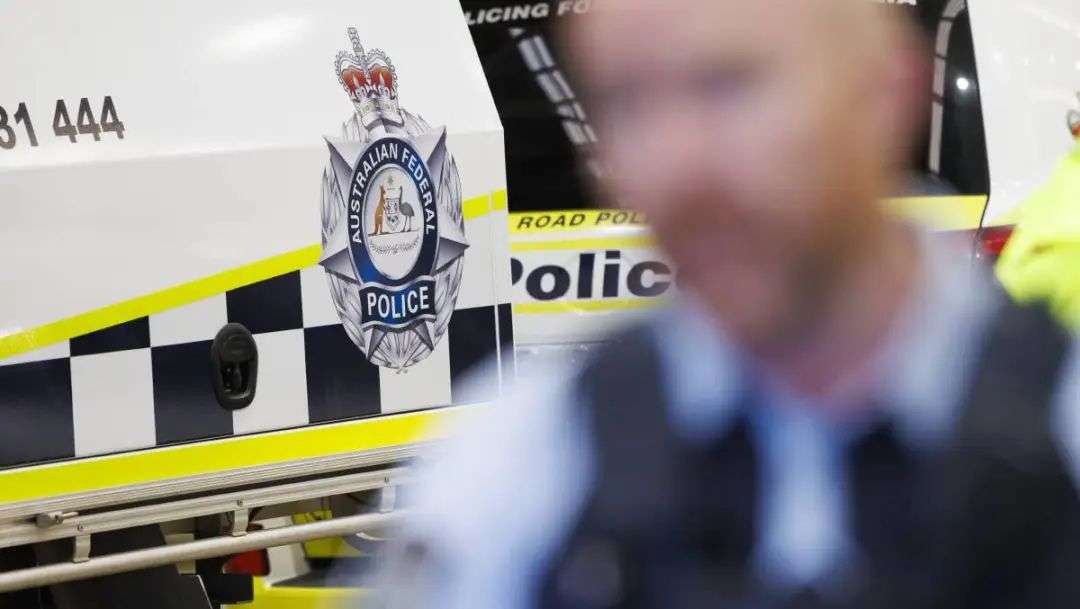 An ACT police car and police officer. Picture by Keegan Carroll