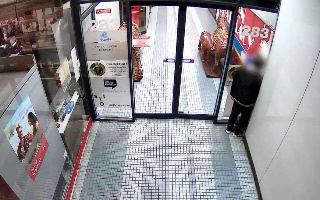 A person caught on CCTV camera taking a wee outside Orenegro on Karangahape Rd, Auckland.