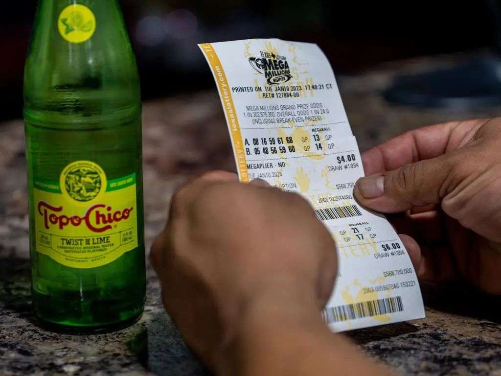 A punter holds a lottery ticket in Austin. Picture: Brandon Bell/Getty Images/AFP