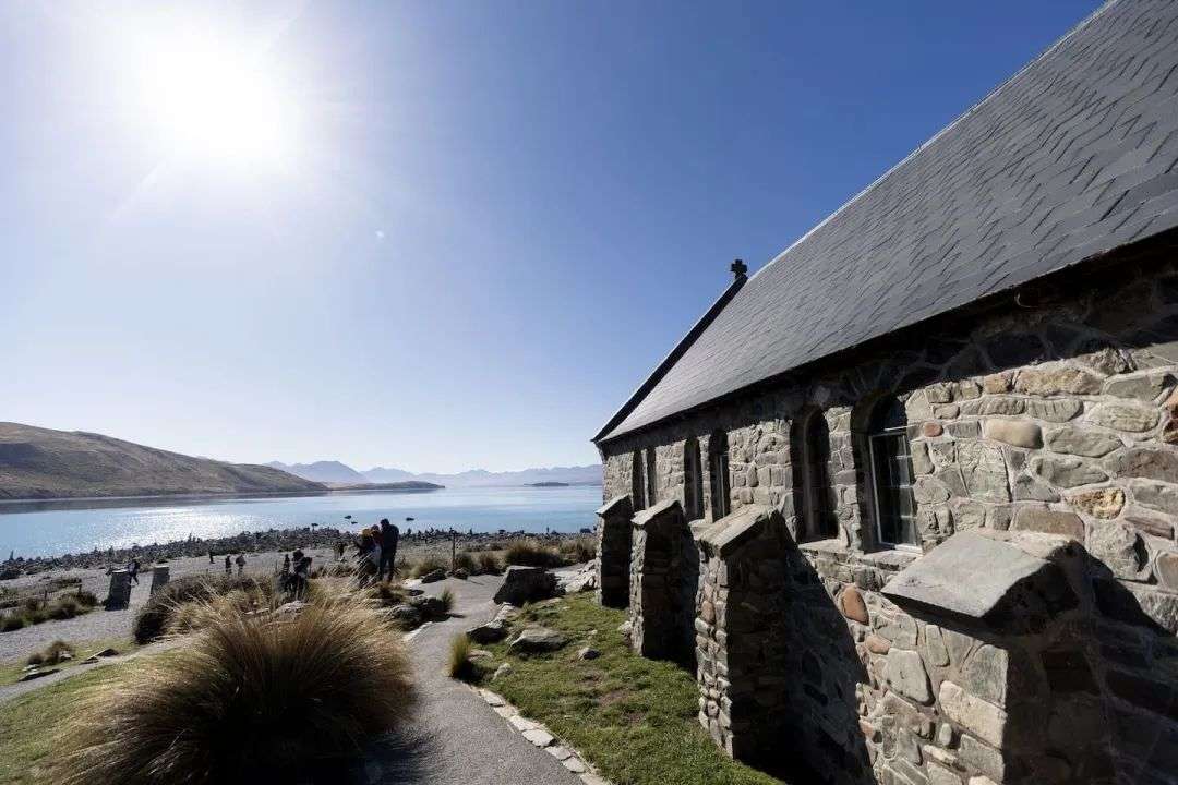 The Church of the Good Shepherd on the shore of Lake Tekapo, with a rapidly changing landscape in front of it. Photo / George Heard