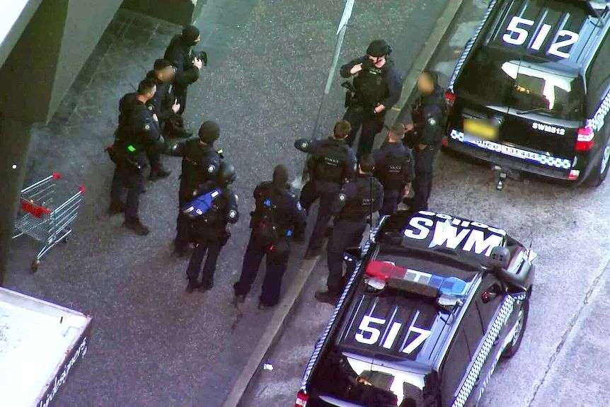 riot squad police prepare to go into westfield bondi junction after a man went on a stabbing spree