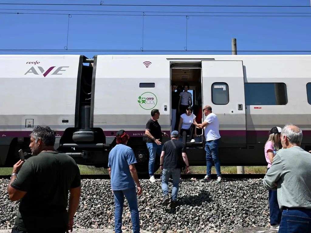 Passengers get off a stranded on a high-speed AVE train near Cordoba. Picture: AFP