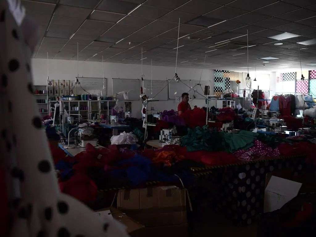 A flamenco dress factory without light and workers. Picture: AFP