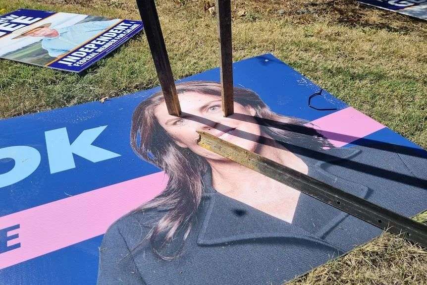 A sign of Kate Hook with two stakes in her face