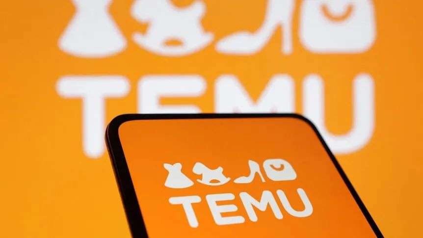 Orange logo of brand Temu displayed on a phone