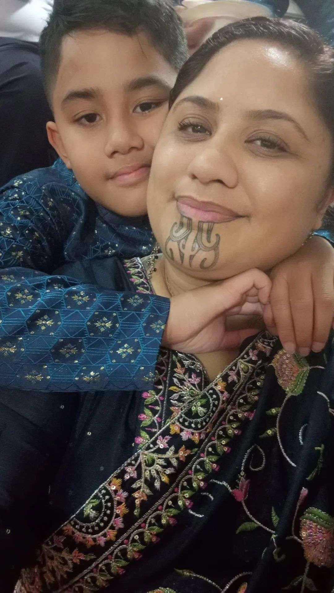 Nursing graduate Mary Parkinson Peni and stepson Zion.