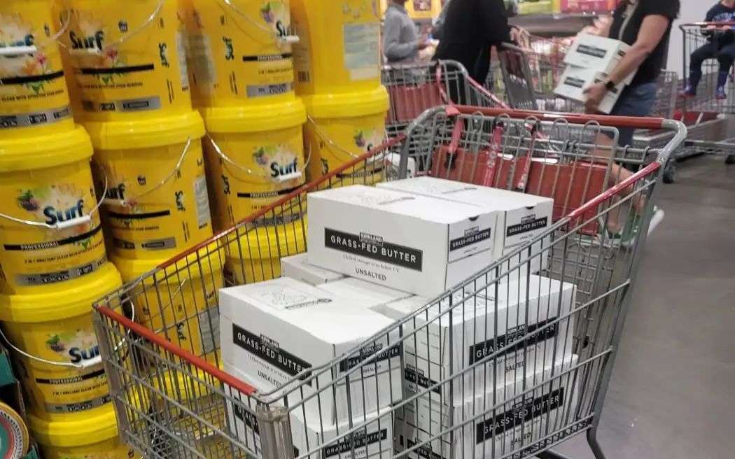 Boxes of 1kg blocks of Kirkland butter at Costco in a trolley