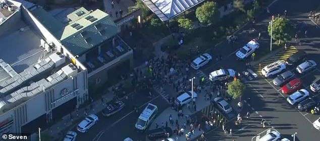 Dozens of emergency vehicles raced to the scene, with a nearby street littered with police cars and ambulances