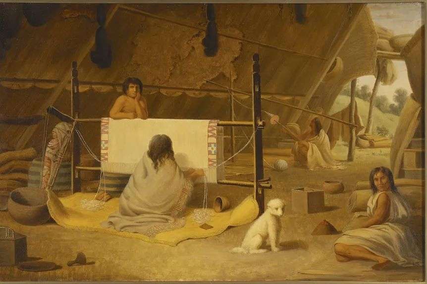 A painting of a native American woman weaving a white blanket with a white furry dog in the foreground.