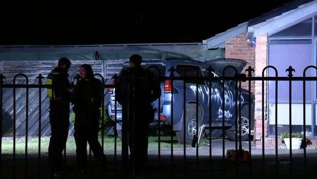 A car spray painted with the message ‘pay your bills’ has crashed into the front of a Melbourne home on Monday morning.