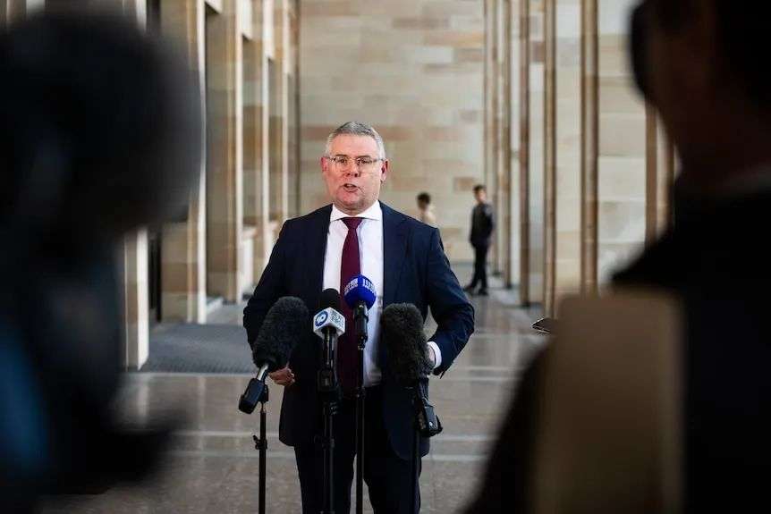 Murray Watt speaking at a press conference.