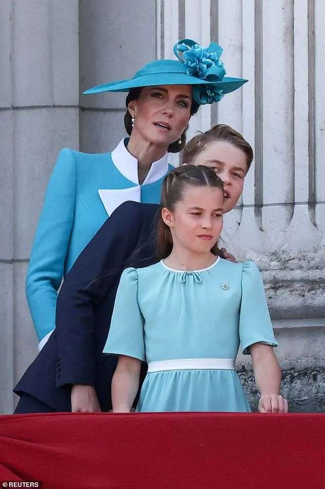 The Princess of Wales, Prince George and Princess Charlotte strain to get a better view of the aircraft during their balcony appearance