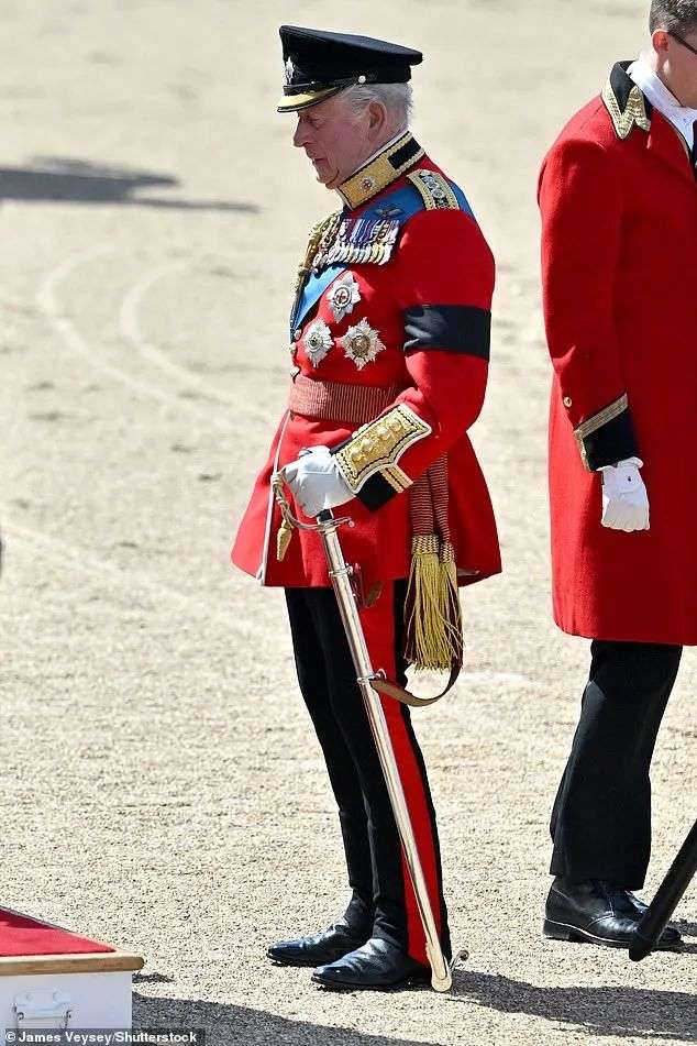 The King is pictured after dismounting his carriage after arriving at the parade ground