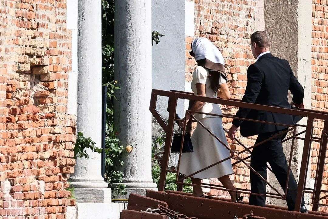 Sanchez, who wore Jimmy Choo sling back pumps, arrives on San Giorgio Maggiore on Friday.