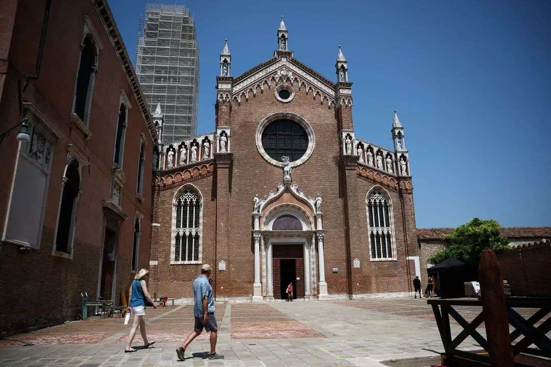 People walk past the Madonna dell’Orto church in Venice ahead of the wedding festivities on Thursday.
