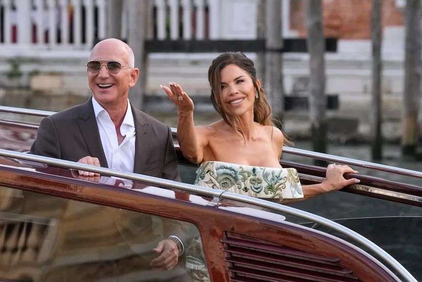Jeff Bezos, left, and Lauren Sanchez on a boat.