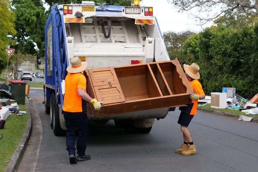 council employees remove kerbside collection items
