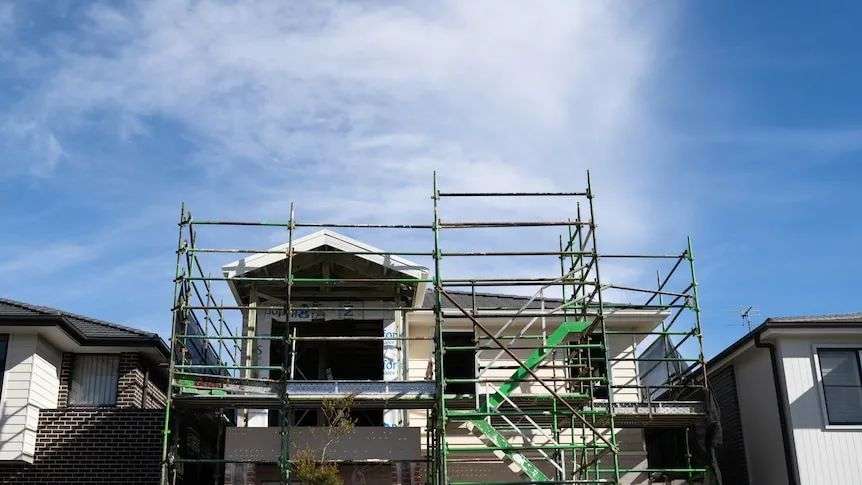 Houses under construction on a bright, sunny day