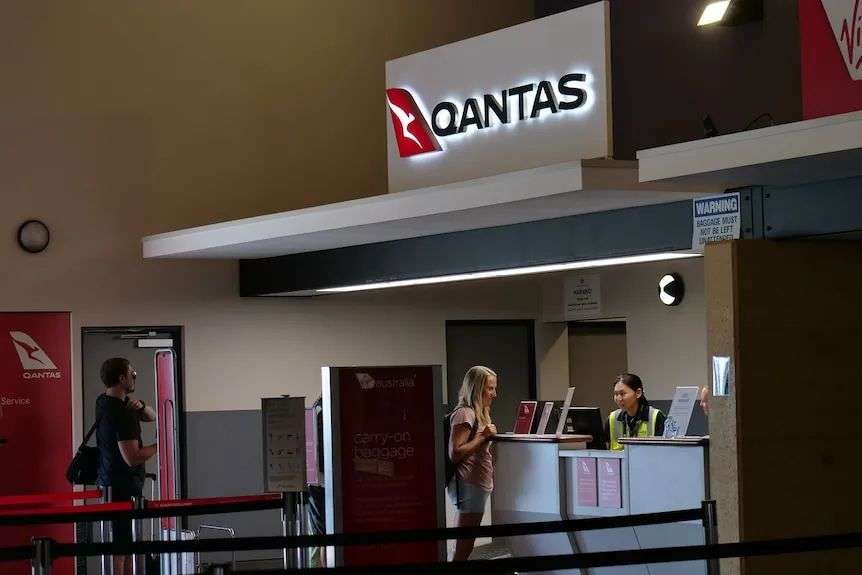 Qantas staff and passengers deal with the aftermath of an emergency landing in Geraldton.