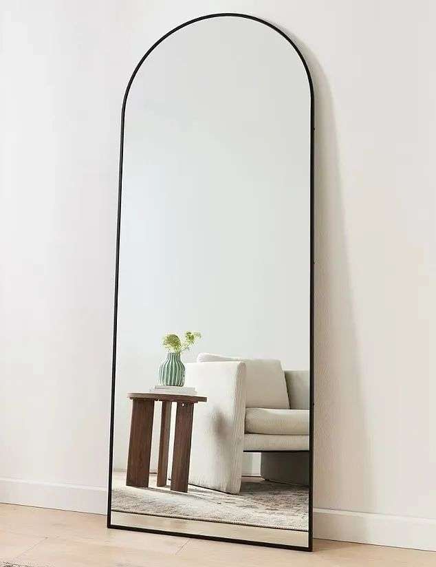 The Arch Black floor mirror ($129), a sleek, full-length mirror with a minimalist arch silhouette and black frame that promises to add a modern elegance to your home