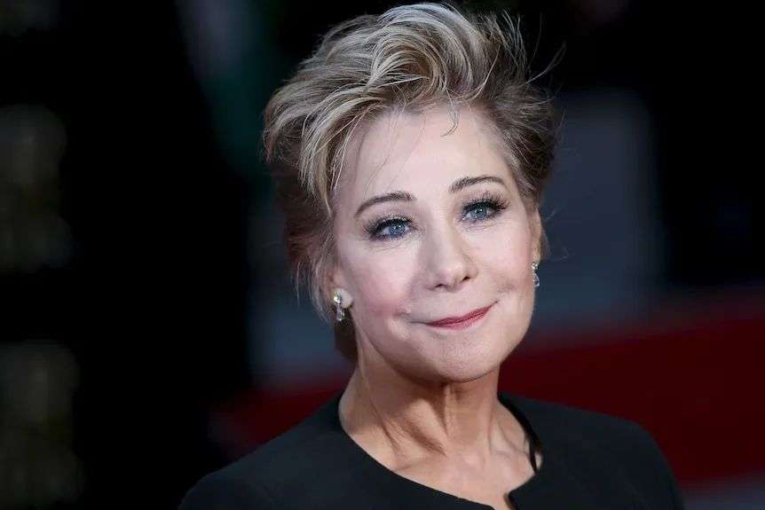 A close up of a woman in a blonde bob