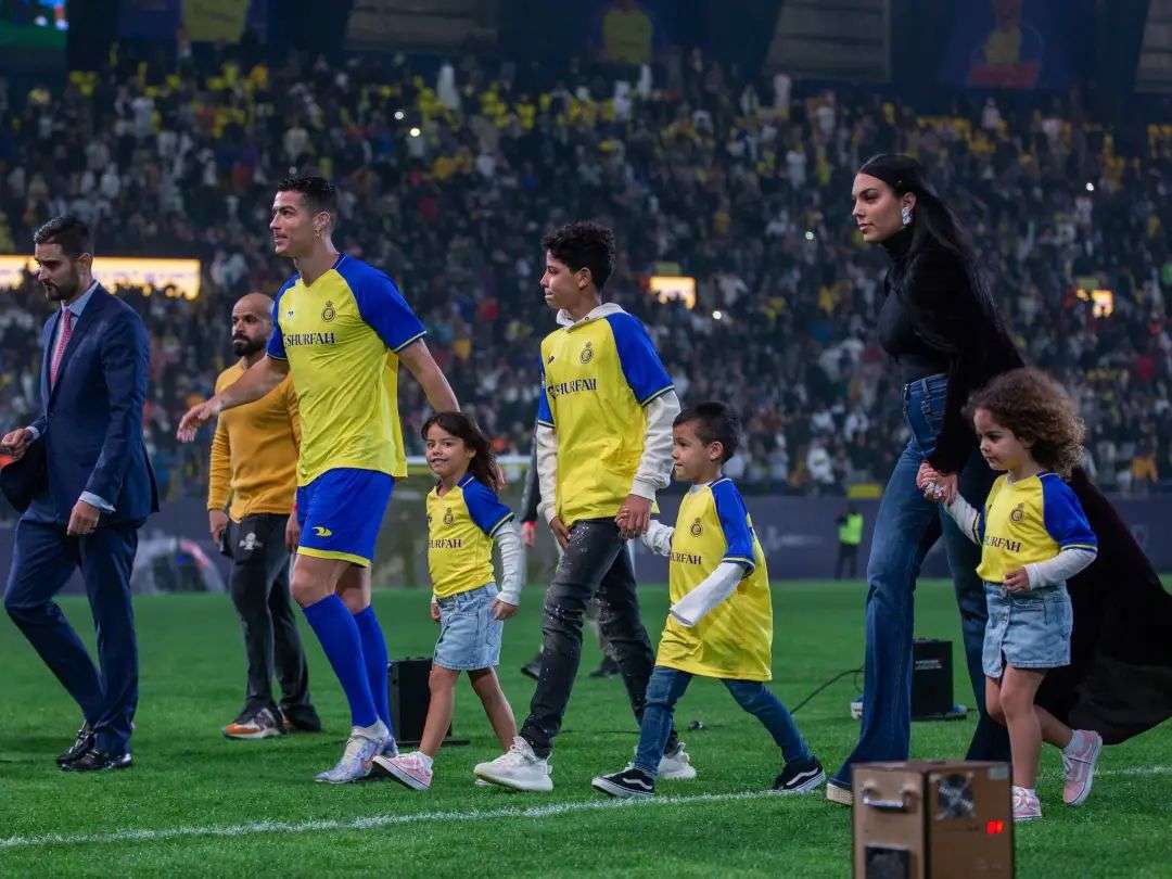 RIYADH, SAUDI ARABIA – JANUARY 03: Cristiano Ronaldo accompanied by his partner Georgina Rodriguez and his son Cristiano Ronaldo Jr, greet the crowd during the official unveiling of Cristiano Ronaldo as an Al Nassr player at Mrsool Park Stadium on January 3, 2023 in Riyadh, Saudi Arabia. (Photo by Yasser Bakhsh/Getty Images)