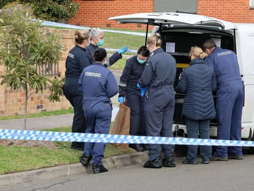 Forensic police prepare to examine the scene. Picture: David Crosling