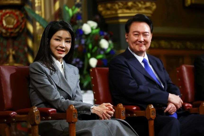 Kim Keon Hee sits with her husband Yoon Suk Yeol.
