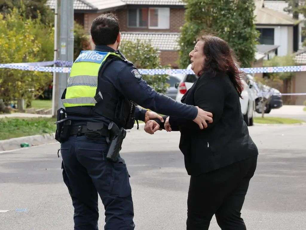 A woman believed to be Ms Georgopoulos’ mother Petty ran through the police tape. Picture: David Crosling