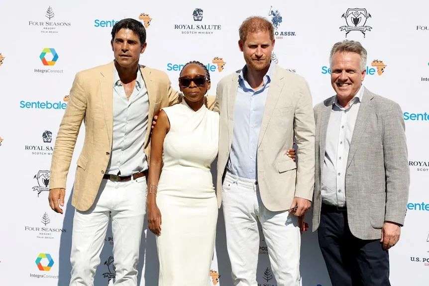 Prince Harry posing for a photo alongside Sentebale chair Sophie Chandauka and others