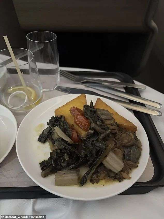 A Qantas business class passenger was served pan fried parmesan polenta with braised greens, wild mushroom ragout and salsa verde (pictured) on a flight from Melbourne to Singapore