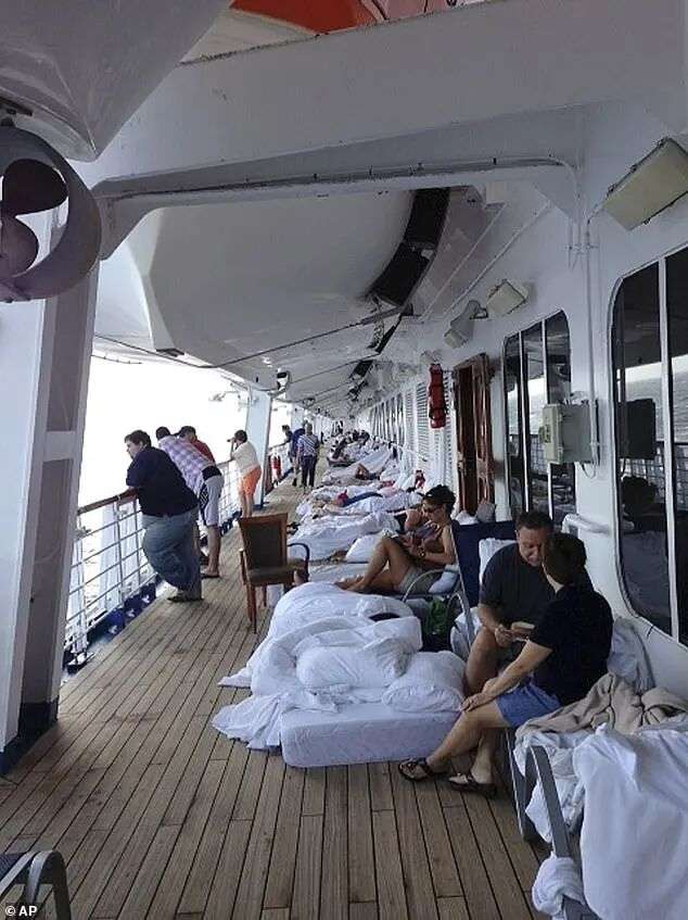 Passengers set up camp on the decks of the boat to avoid the foul smell of their cruise-mates' plumbing