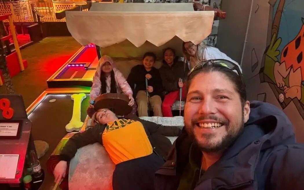 John Bryers Ruddock pictured with his children, who are 8, 9 and 12.