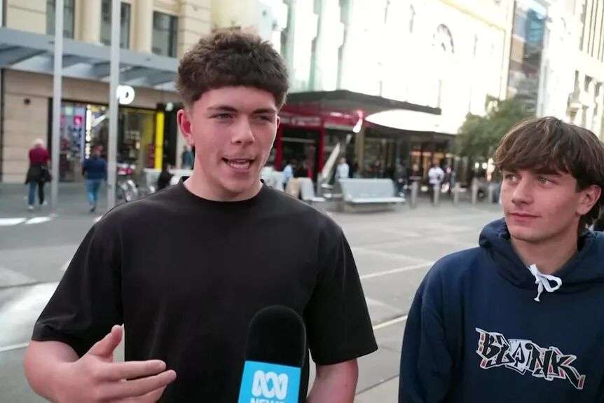 Young men in Bourke Street Mall giving their account of a police chase they witnessed