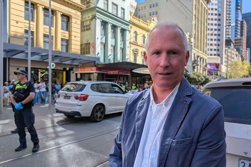 Middle aged man in blazer pictured in Bourke Street Mall, Melbourne