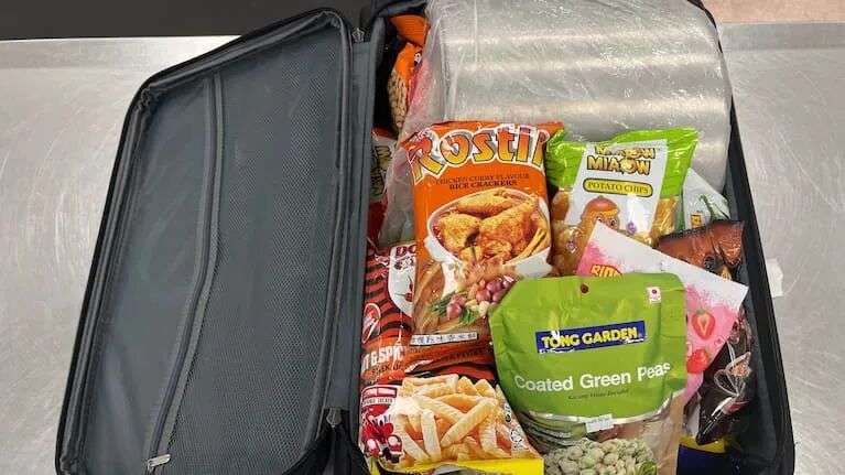 An x-ray revealed inconsistencies around the lining of a cooking pot that was in his suitcase.