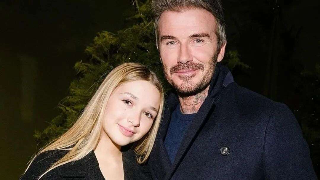 David and Harper Beckham pose for a photo