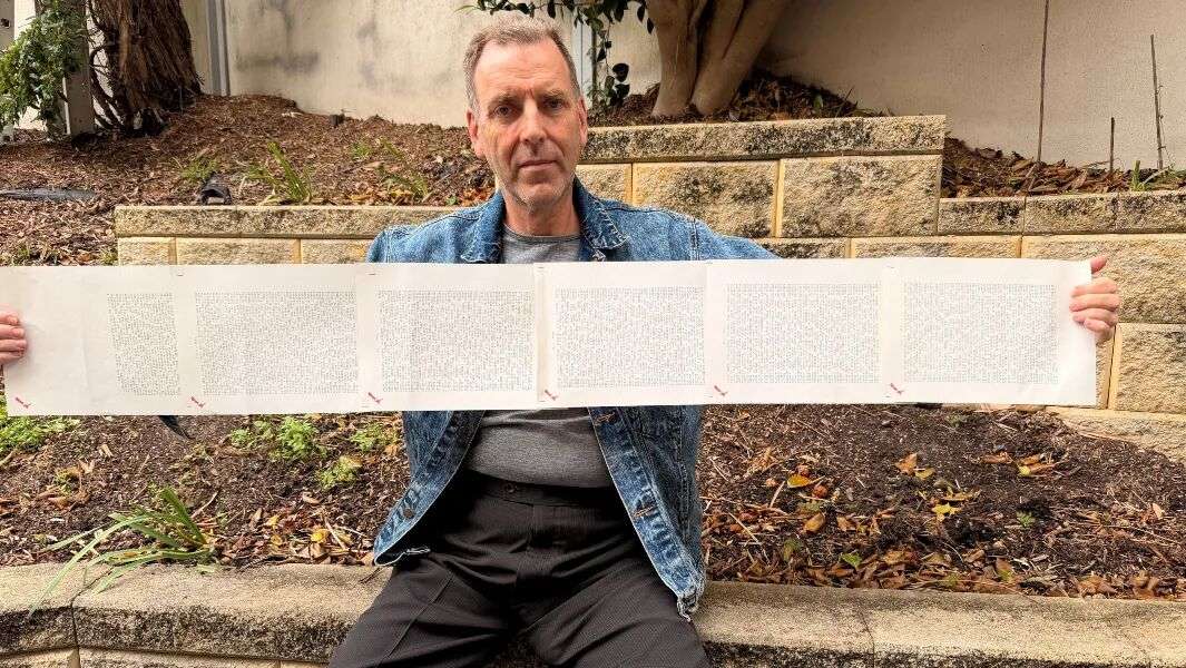 Laurence holding six pages showing his full name