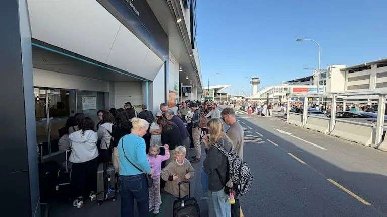 Guests gather outside Auckland Airport domestic terminal.