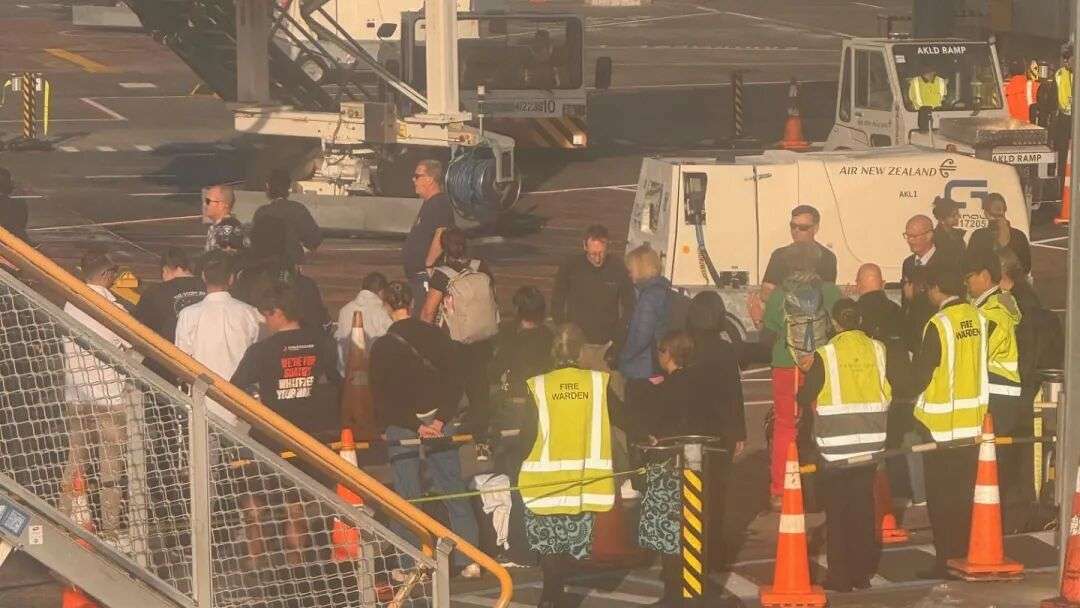 Some travellers were airside when the fire alarm went off at Auckland Airport's domestic terminal this morning, forcing them to remain on the tarmac. Photo / Georgie Smith