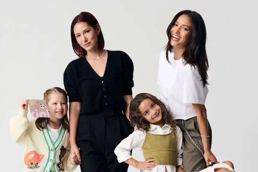 Esther Song and Shay Mitchell posing with their kids in a studio