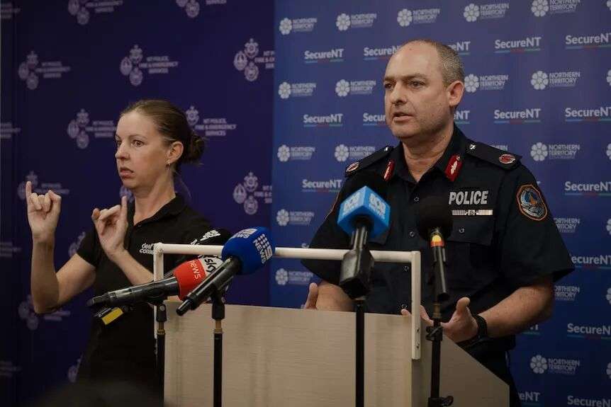 A man dressed in official police uniform, speaking into an ABC News microphone.