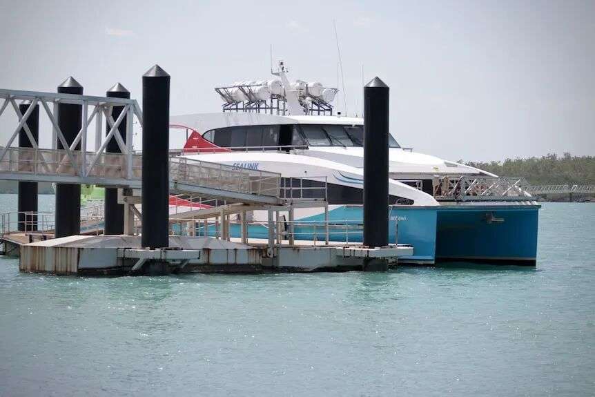 A ferry docked on an island.