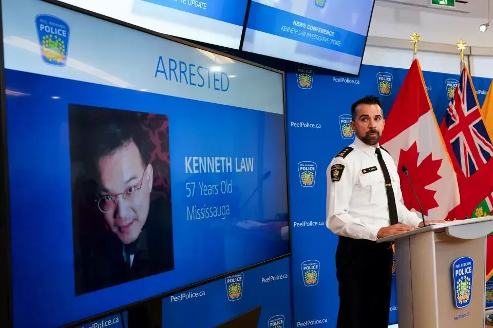 Police press conference announcing the arrest of Kenneth Law.