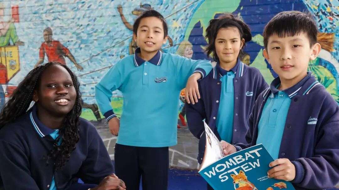 Victoria’s Sunshine Harvester Primary School students Tahani, Jaden, Archie and Sean celebrate their school’s top results. Picture: Ian Currie