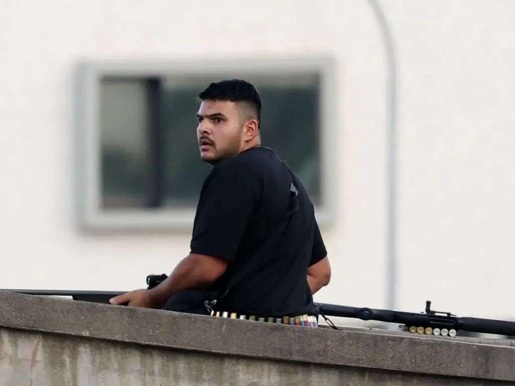 Naveed Akram stands on top of the Bondi Beach overpass where he and is father opened fire on people in Bondi. Picture: Matrix News