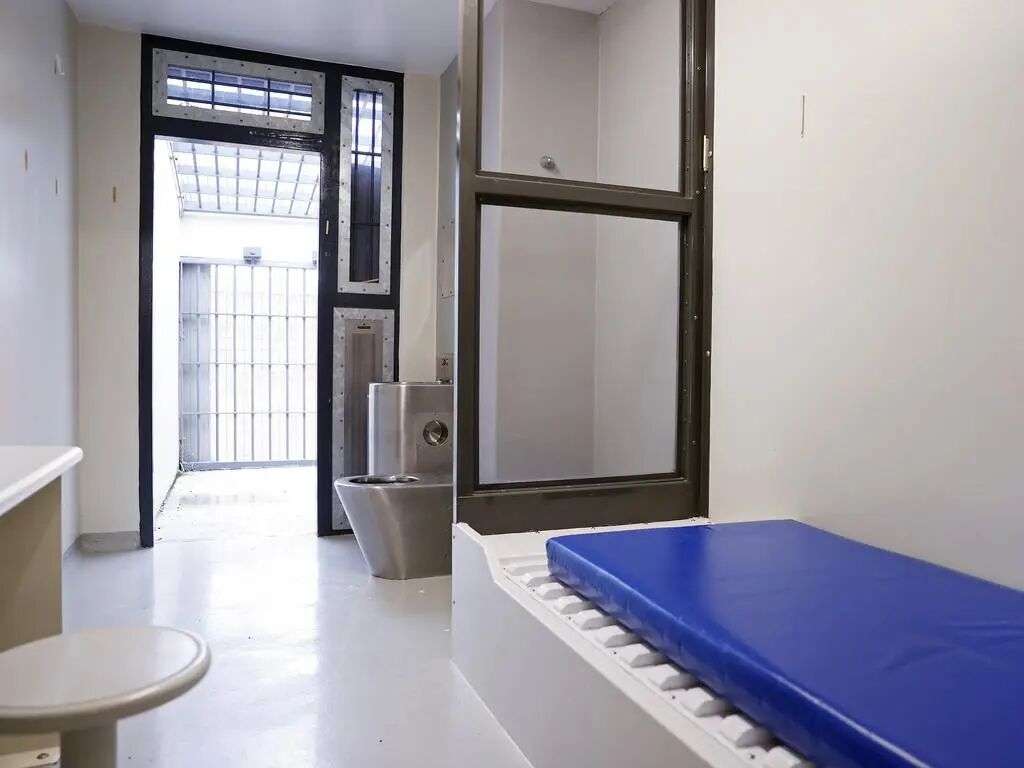 Cells line narrow corridors, each door marked with an identification sheet listing the inmate’s name, sentence length, dietary requirements and — critically — who they are permitted to associate with during their limited time outside the cell. Picture: Sam Ruttyn