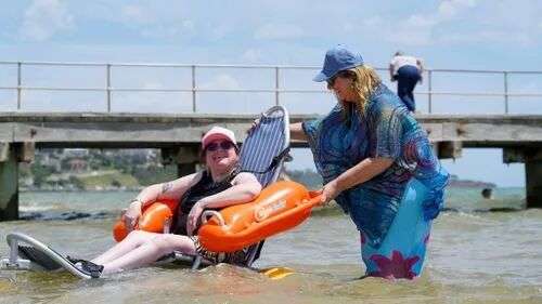 Carly Burns, 38, was the first person to use the beach wheelchairs at Frankston beach.